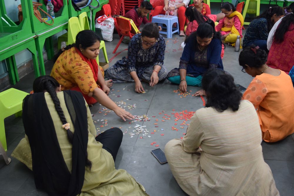 Trainees designing a learning-through-play mela for children and parents